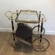 Rolling table in brass and mahogany with removable trays