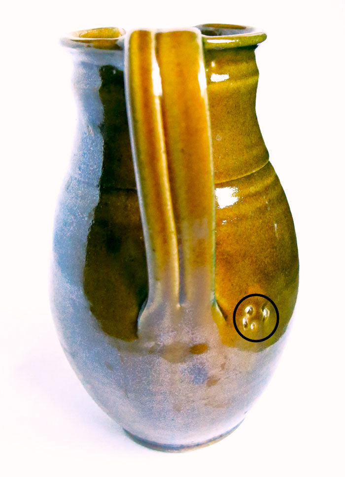 Pitcher of sandstone glaze degraded with chestnut and ochre