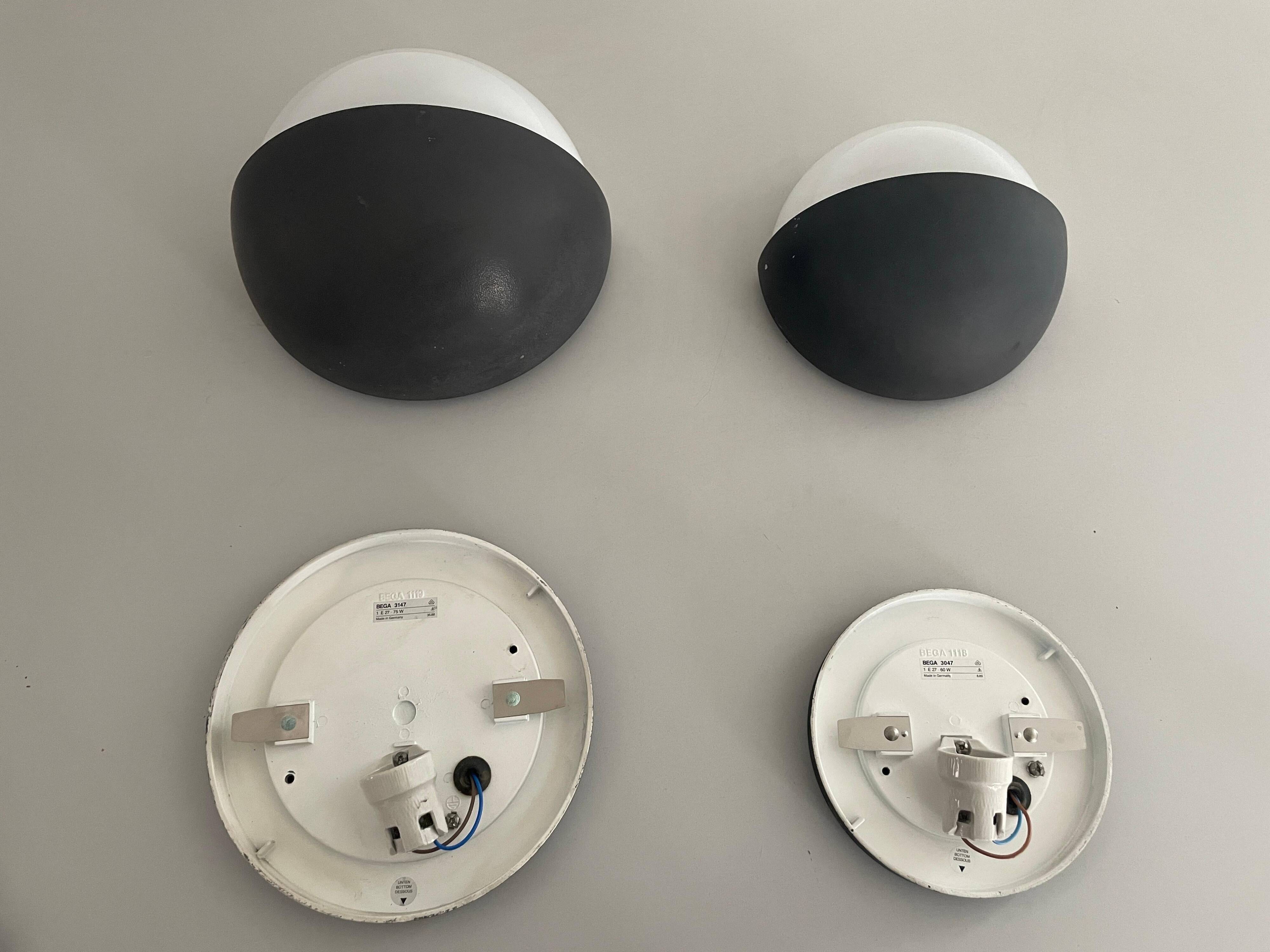 Round black metal wall lights, small and large set, by Bega, 1970s, Germany.