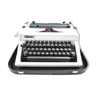 Erika 100 vintage collector's typewriter revised with its leather suitcase