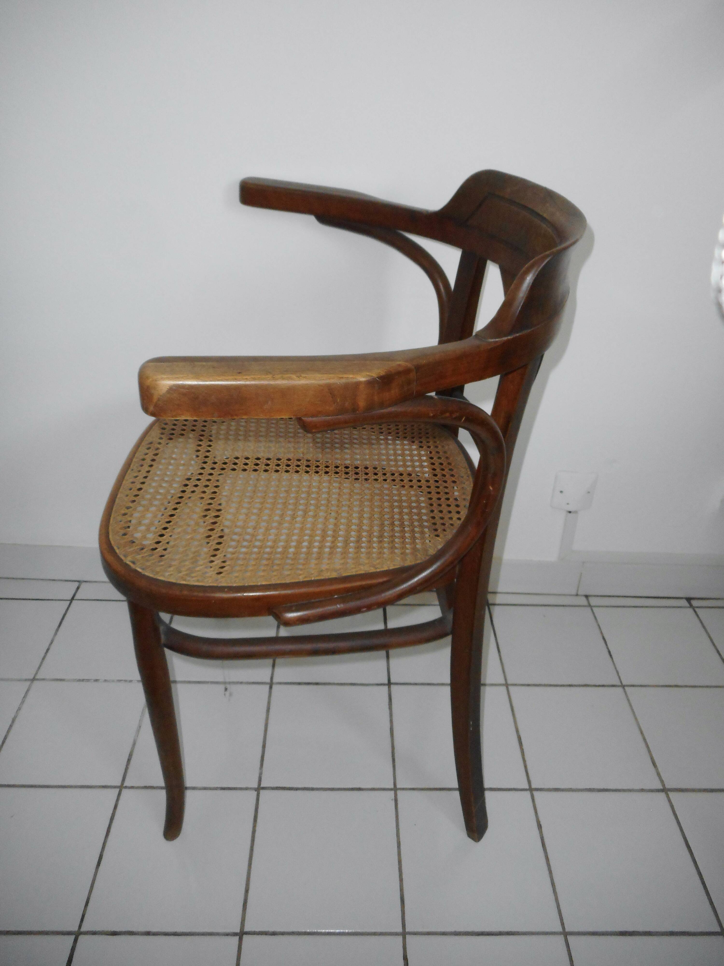 Wooden armchair with caned base