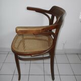 Wooden armchair with caned base