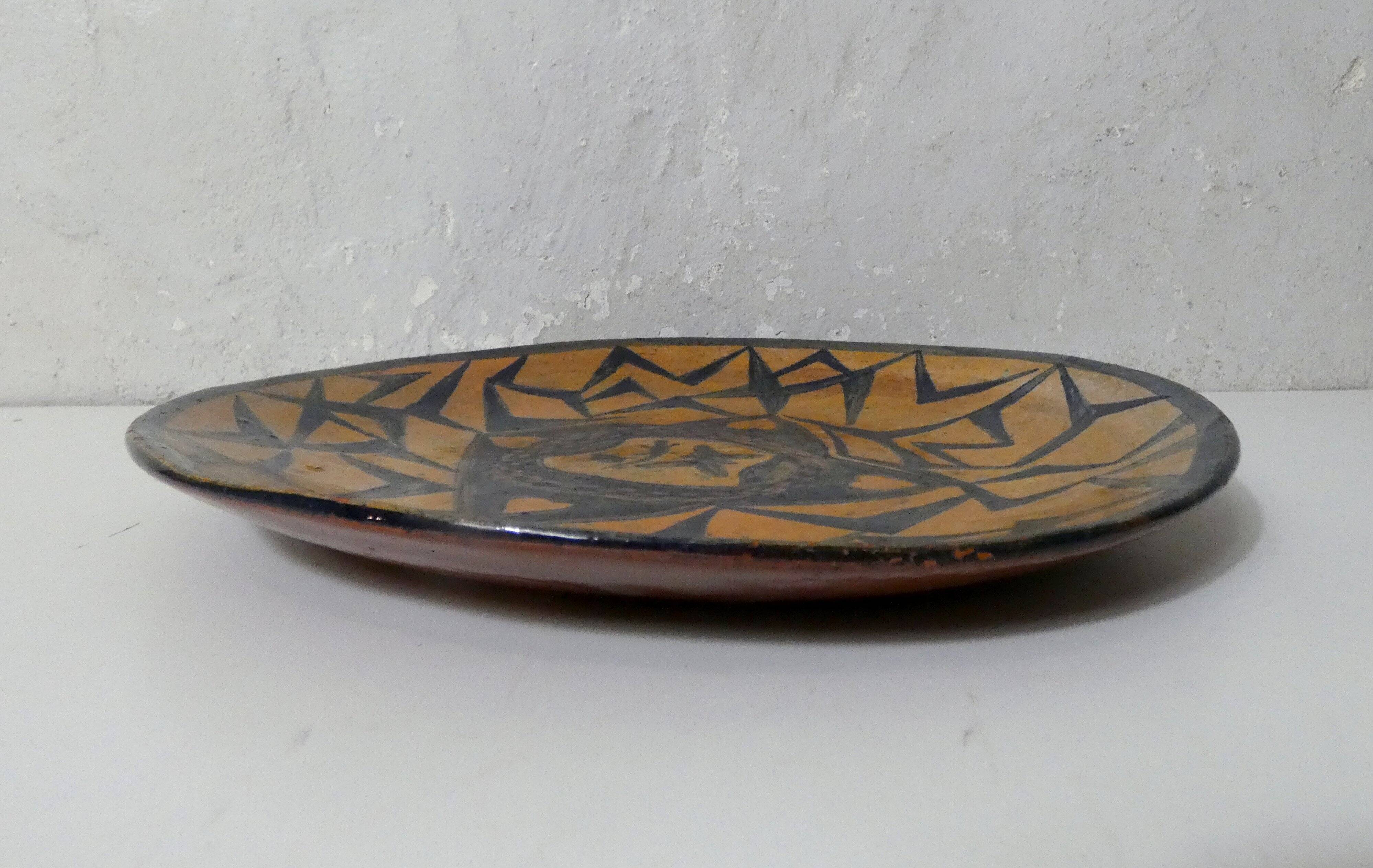 vintage signed glazed terracotta plate in ethnic style