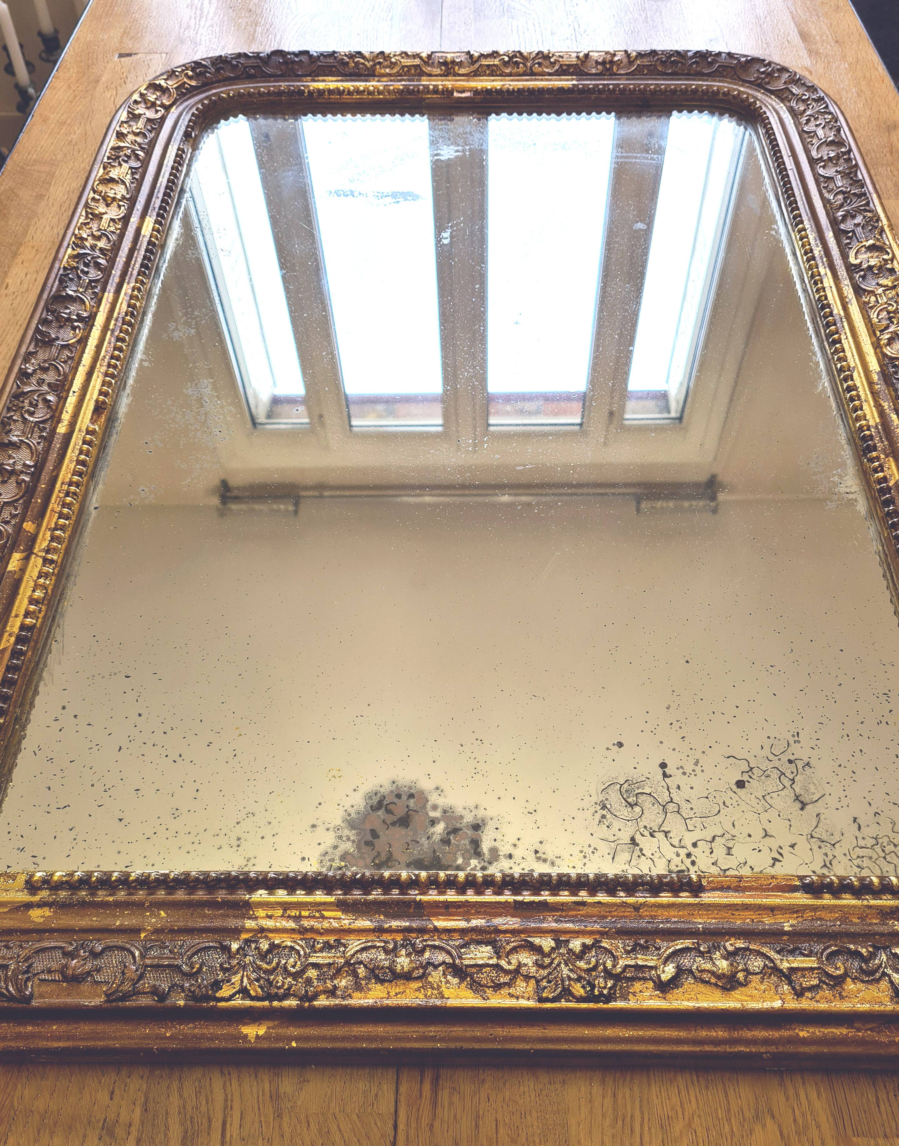 Old Louis Phillipe mercury mirror, in gilded stucco.