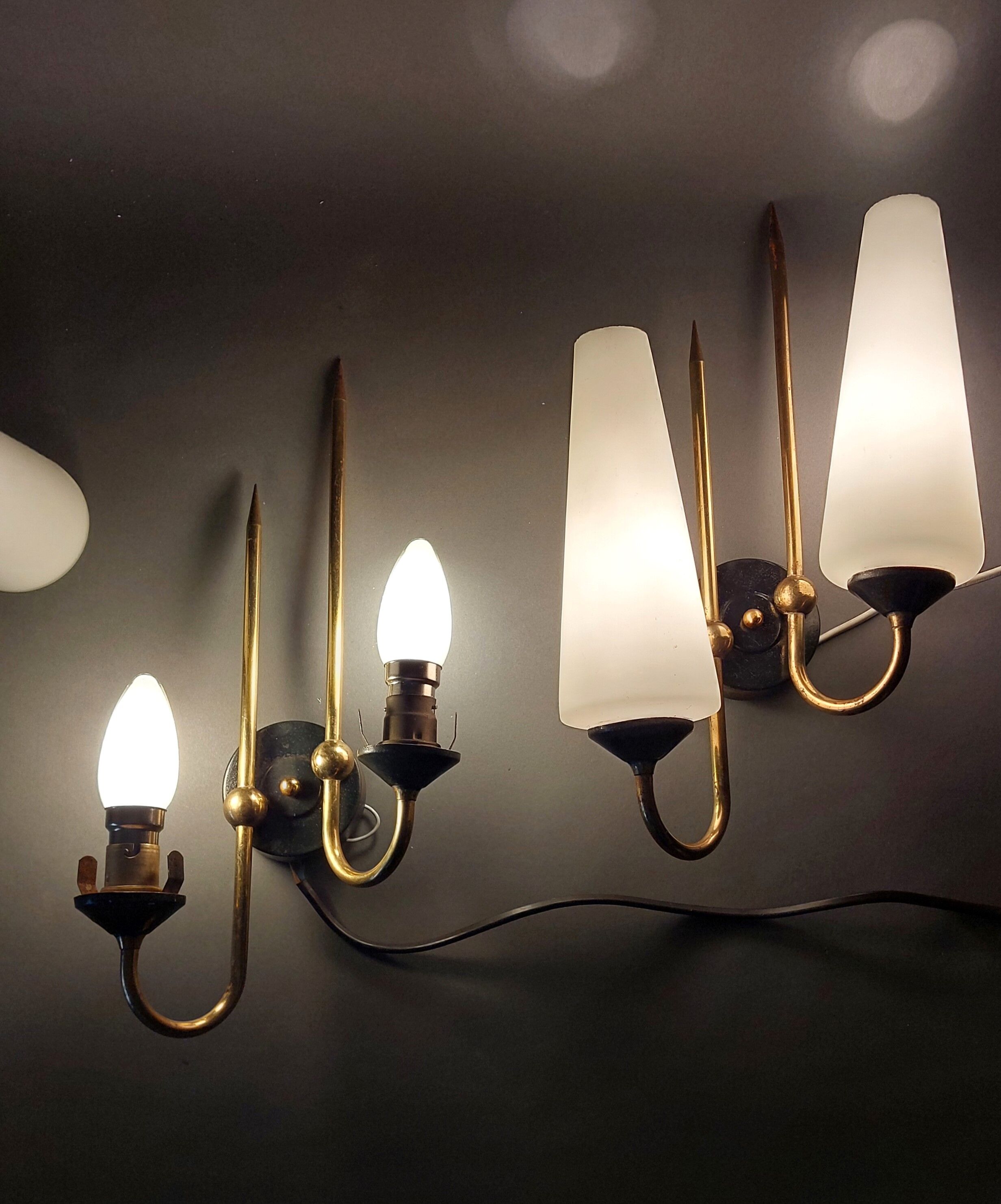 Pair of sconces in black metal and gilded brass 1960 Vintage.