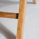 Reclining armchair in natural wood and woven rattan