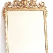 Golden mirror in the Louis XVI style from the 20th century.