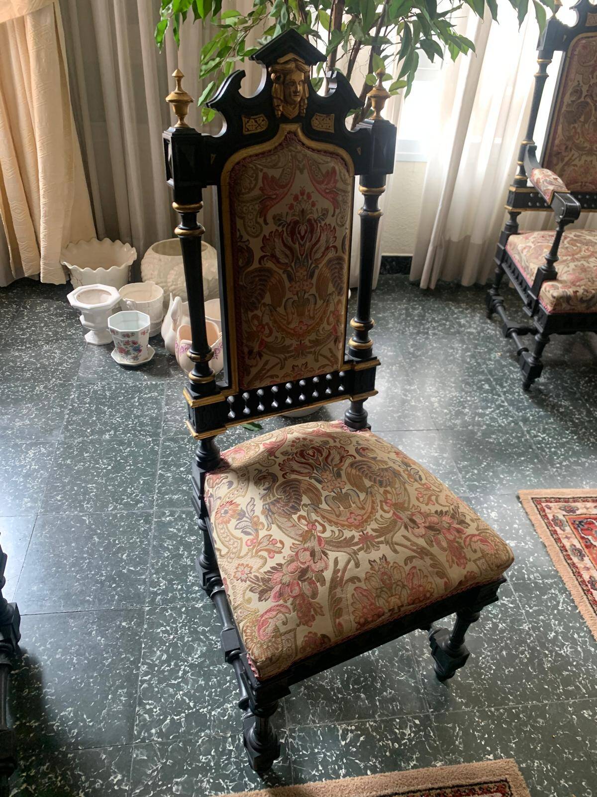 Historicist chair in ebonised and gilded wood