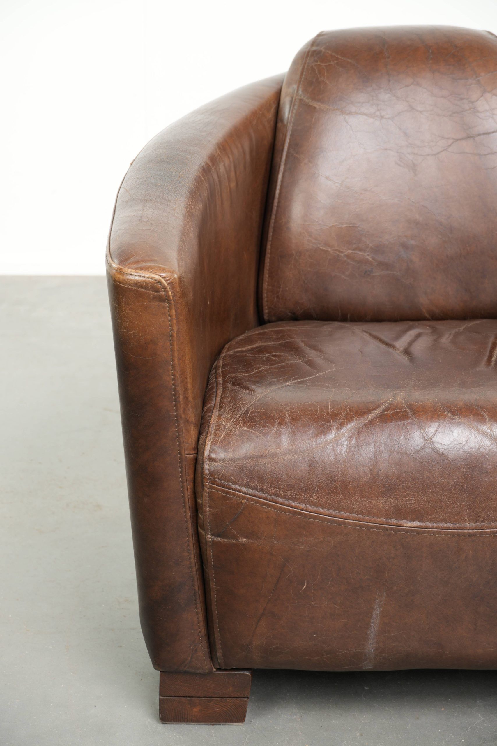Sturdy dark cognac brown cow leather Aviator design armchair