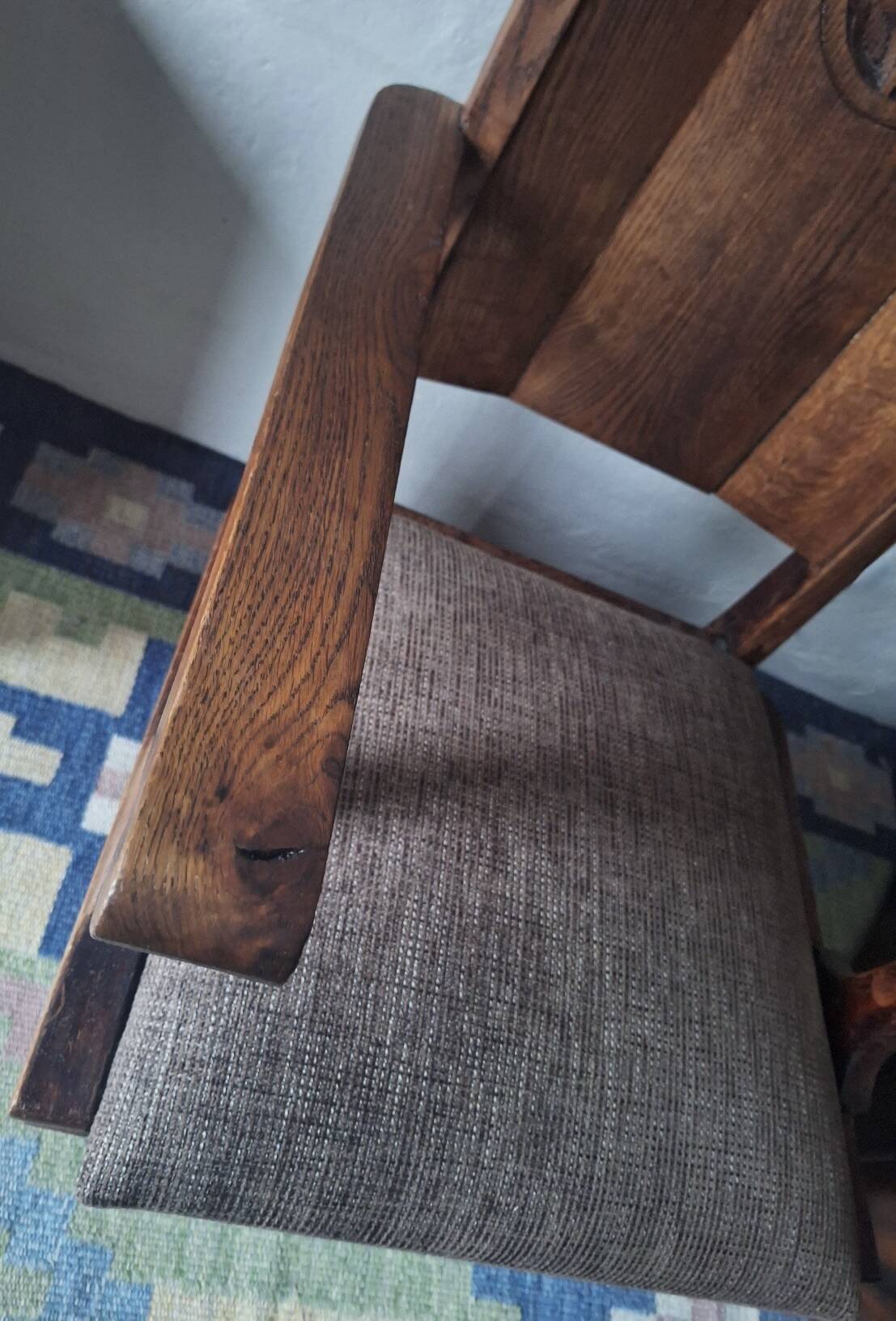 Antique arts and crafts carved oak armchair, 1910