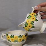 Sunflower flower cups and milk jug