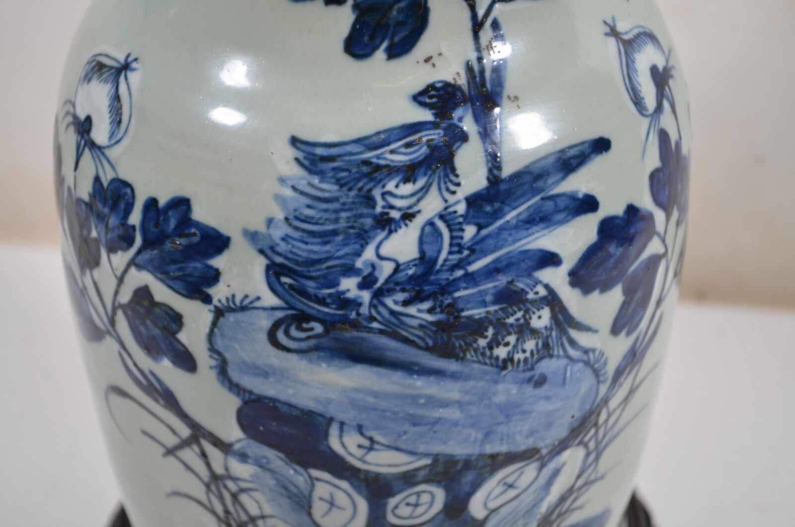 China. Porcelain mallet vase with blue and white phoenix decoration on a rock.
