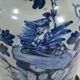 China. Porcelain mallet vase with blue and white phoenix decoration on a rock.