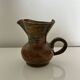 Patinated stoneware jug