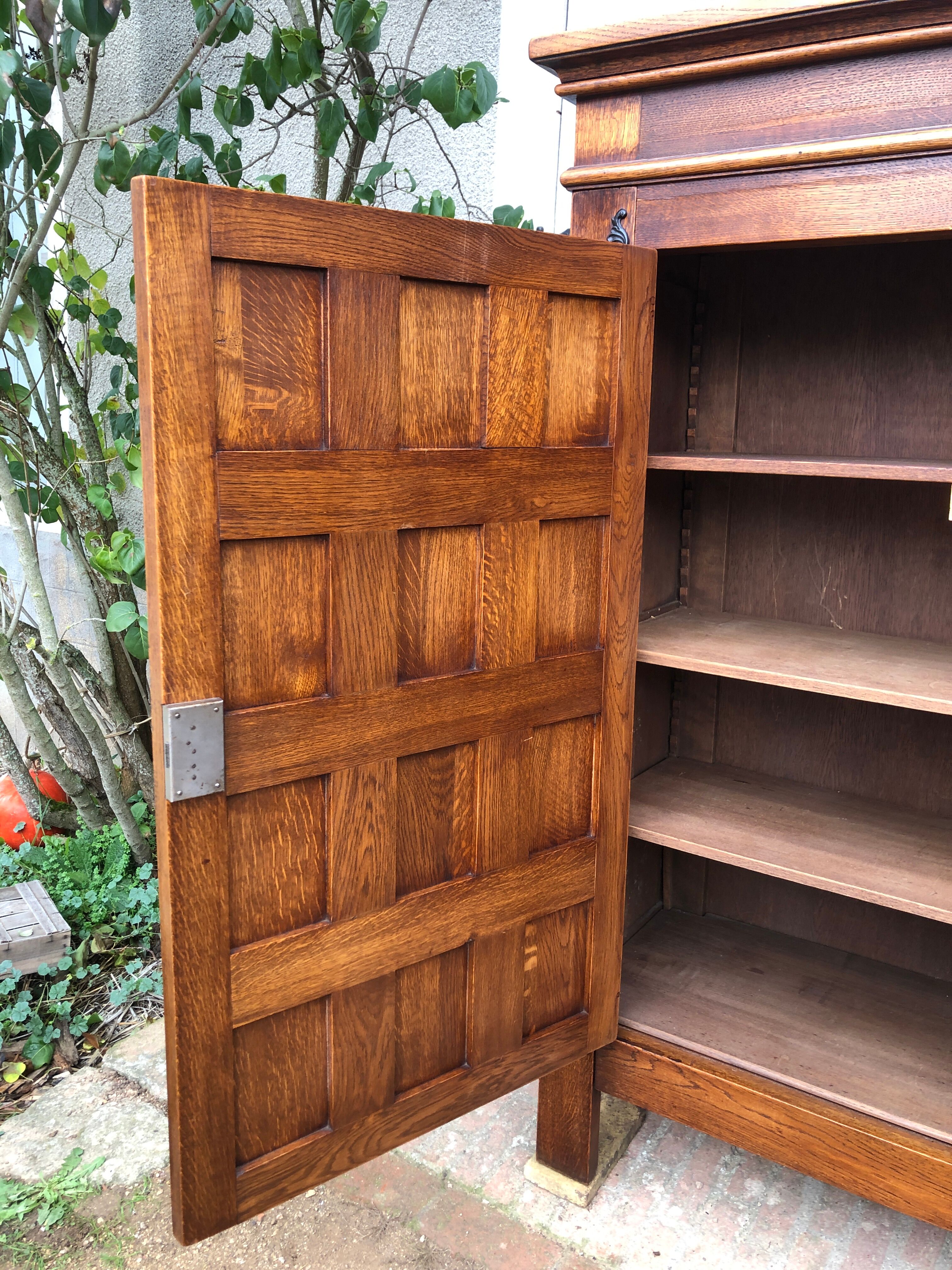 Spanish furniture with carved wood profiles and coats of arms from the 1950s.