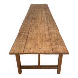 Solid wood workshop table with straight legs.