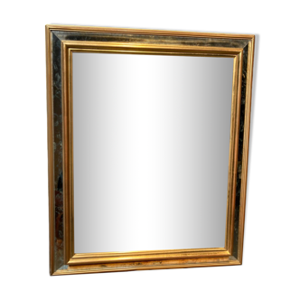 Beveled mirror in gold metal