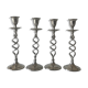 Four twisted silver candlesticks