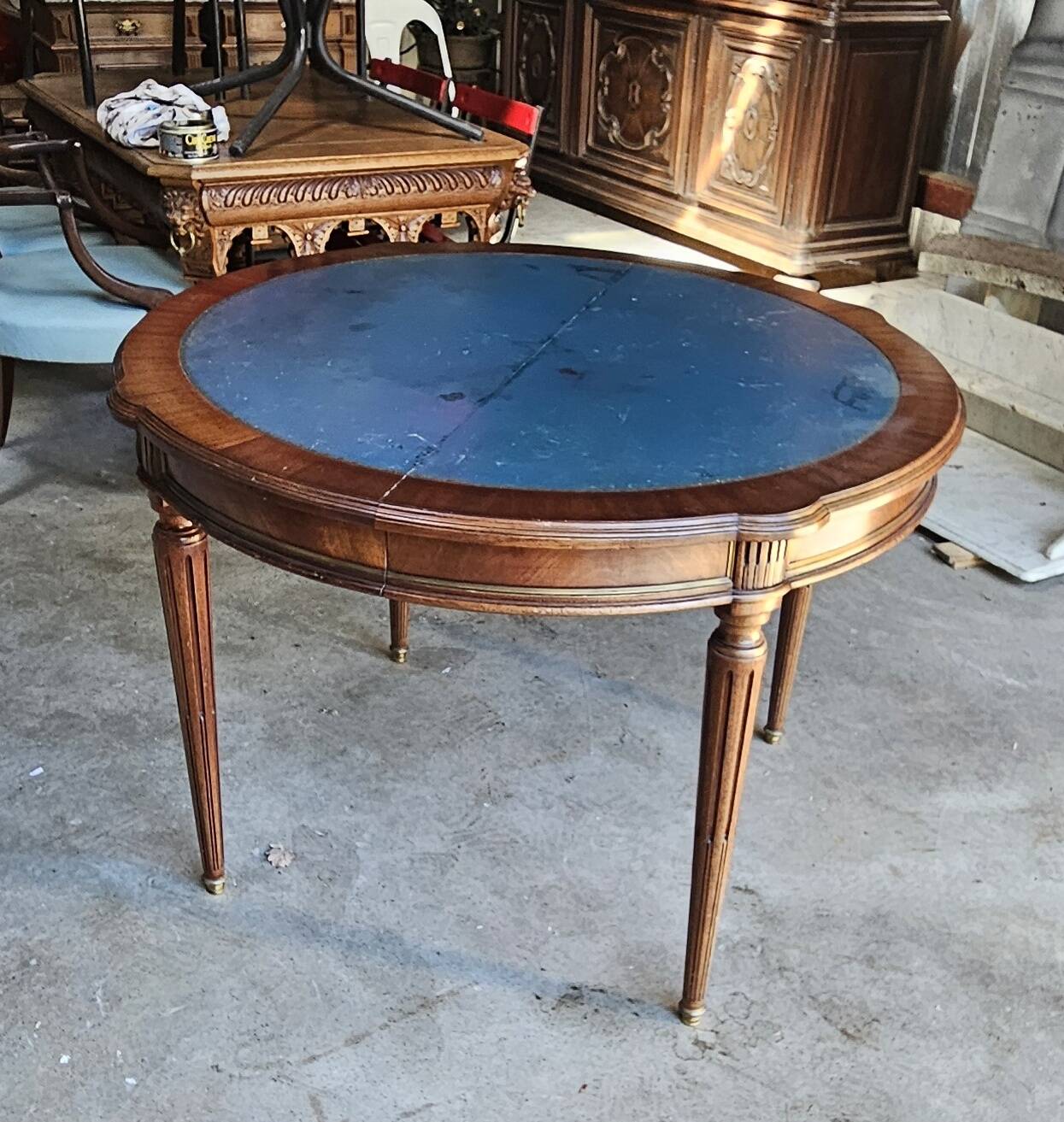 Elegant game table or circular extending side table in Louis XVI style.