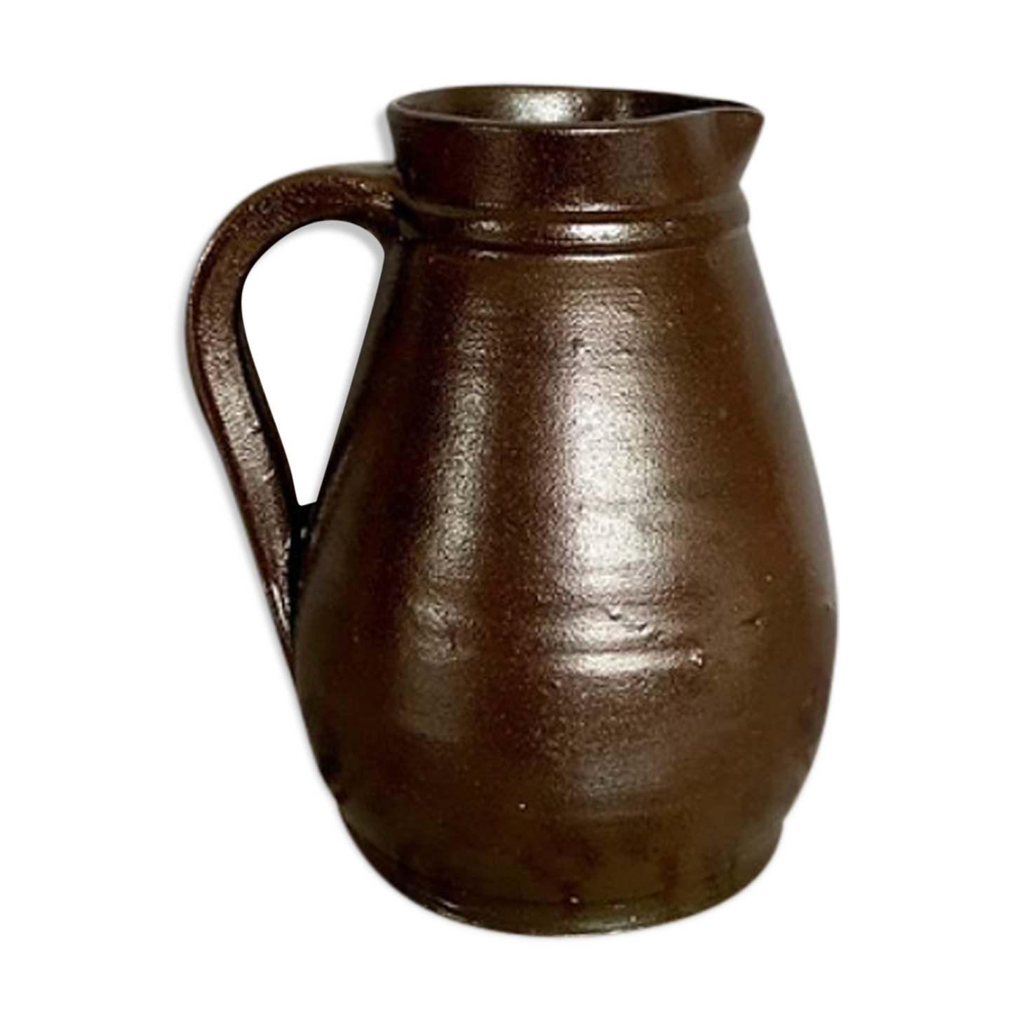 Pitcher in dark brown sandstone