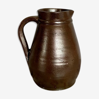 Pitcher in dark brown sandstone