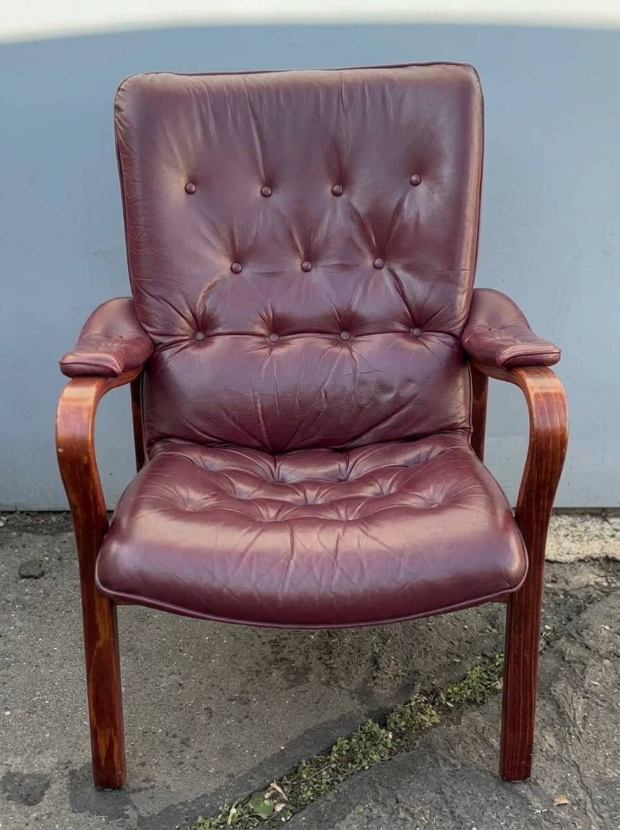 Scandinavian armchair with footrest