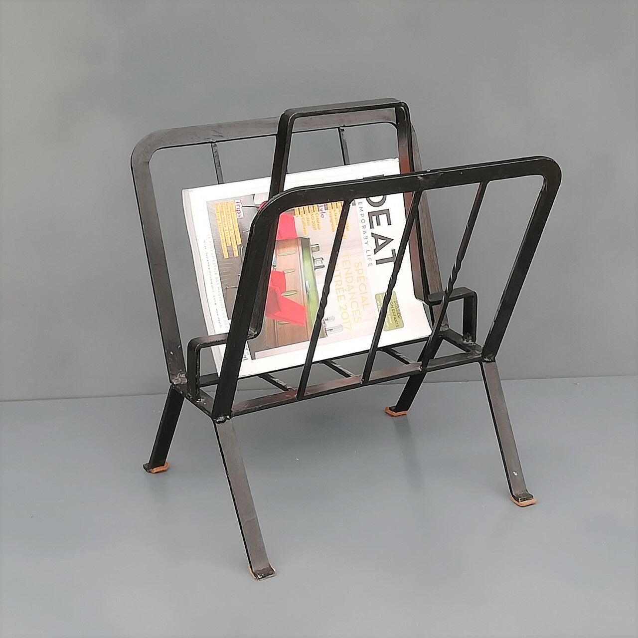 Black painted metal magazine holder