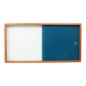 A vintage mid-century wall hung oak cabinet, blue & white sliding glass doors