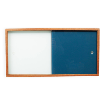 A vintage mid-century wall hung oak cabinet, blue & white sliding glass doors