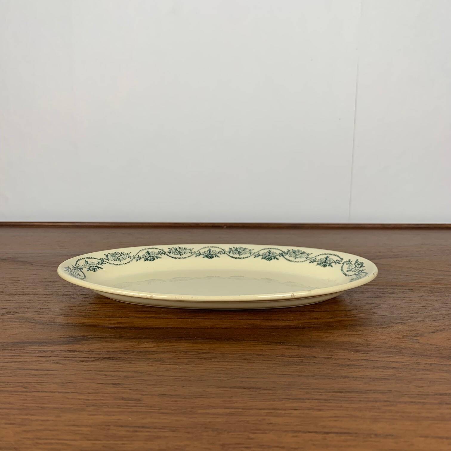 Small St Amand Ceranor dish, dark green flower pattern