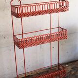 Vintage shelf in red openwork metal
