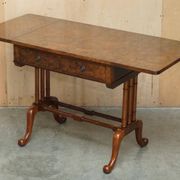 Antique extendable coffee table circa 1880 in solid walnut.