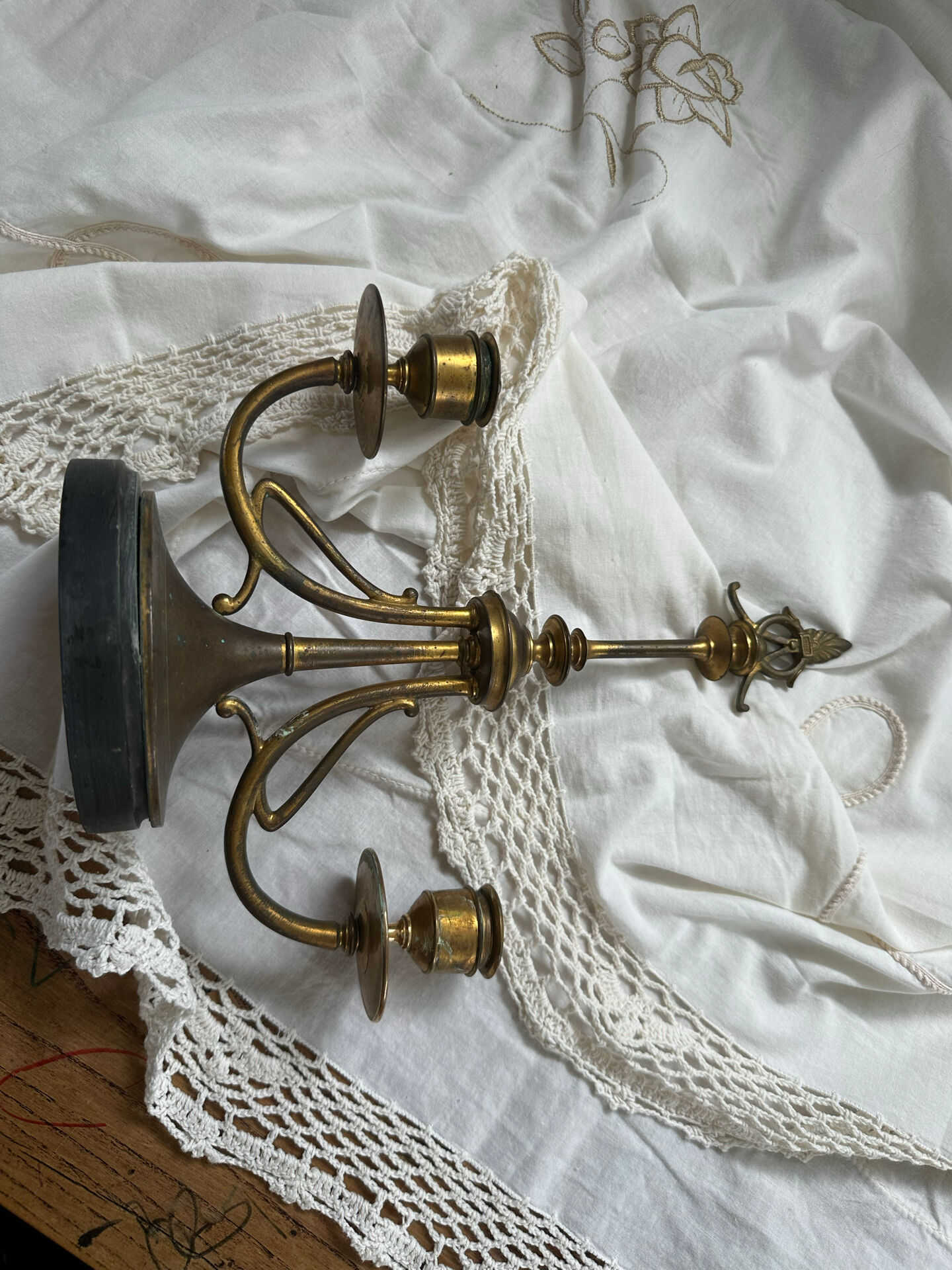 Pair of Empire style candlesticks, patinated brass and black stone.
