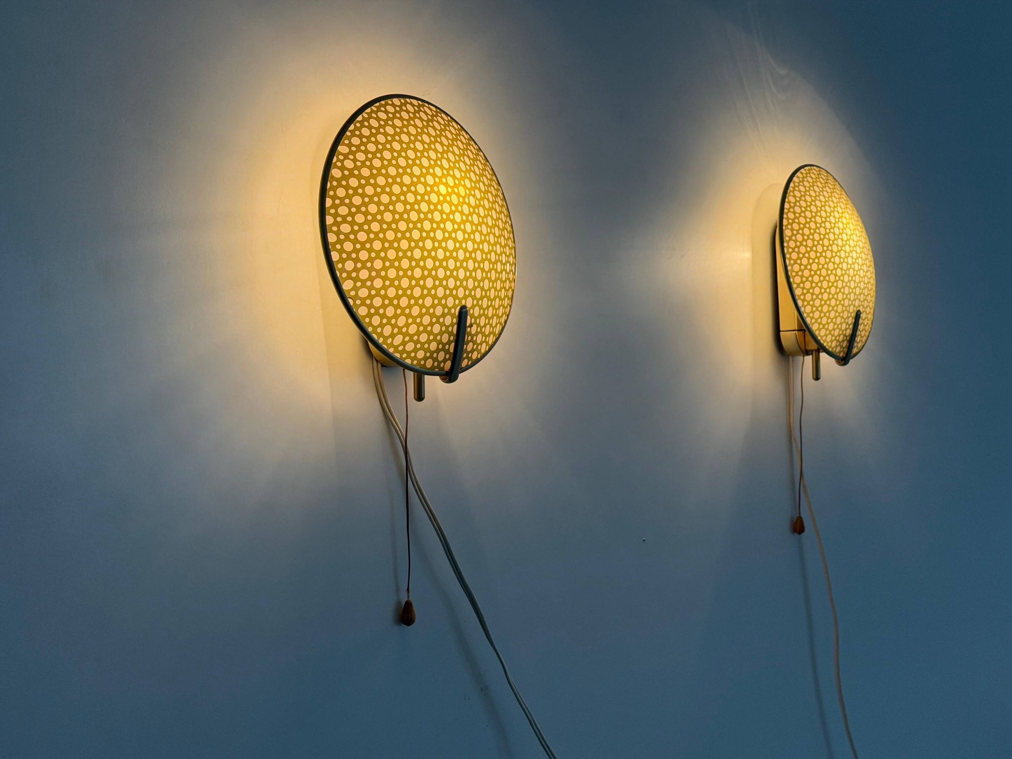 Pair of green plexiglass and gold metal wall lights by Erco, 1950s, Germany.