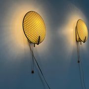 Pair of green plexiglass and gold metal wall lights by Erco, 1950s, Germany.