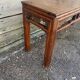 Asian low console in natural wood
