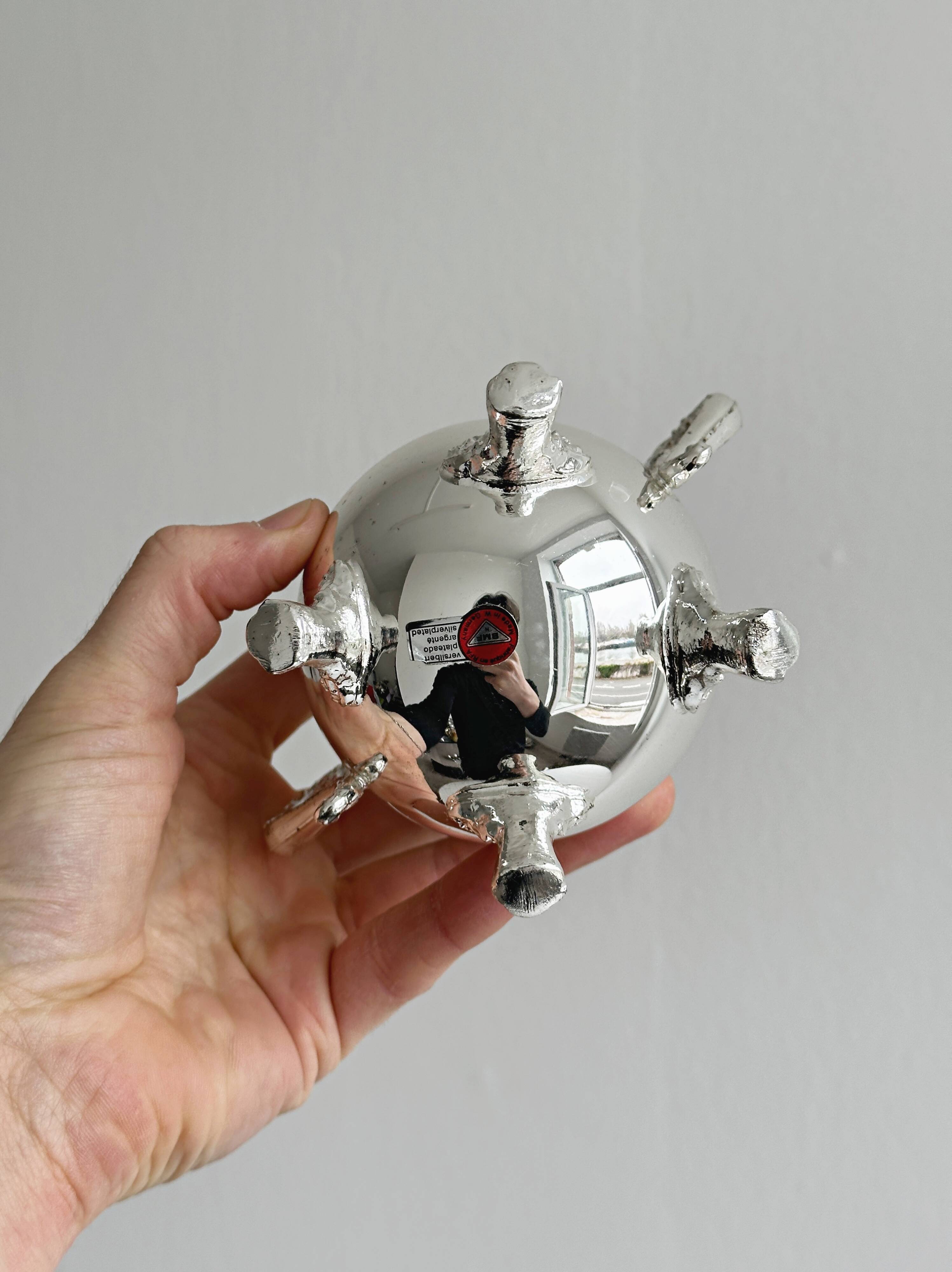 Antique shiny metal sugar bowl