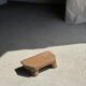 Small stool, teak footrest with short cut corners.