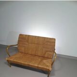 Vintage French papercord sofa with a metal frame base