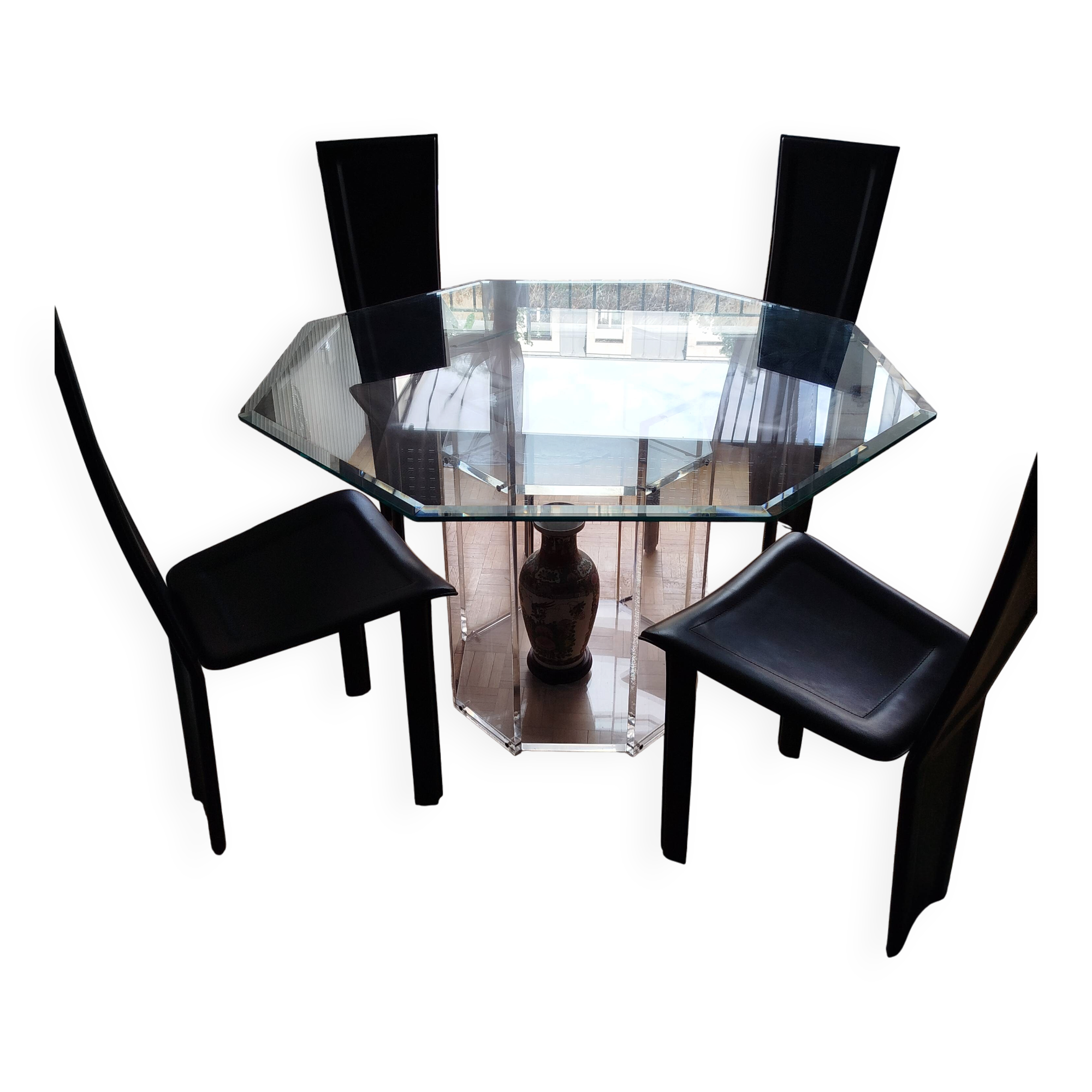 For sale: bevelled glass table and Artedi leather chairs.