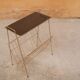 Vintage gold metal magazine rack