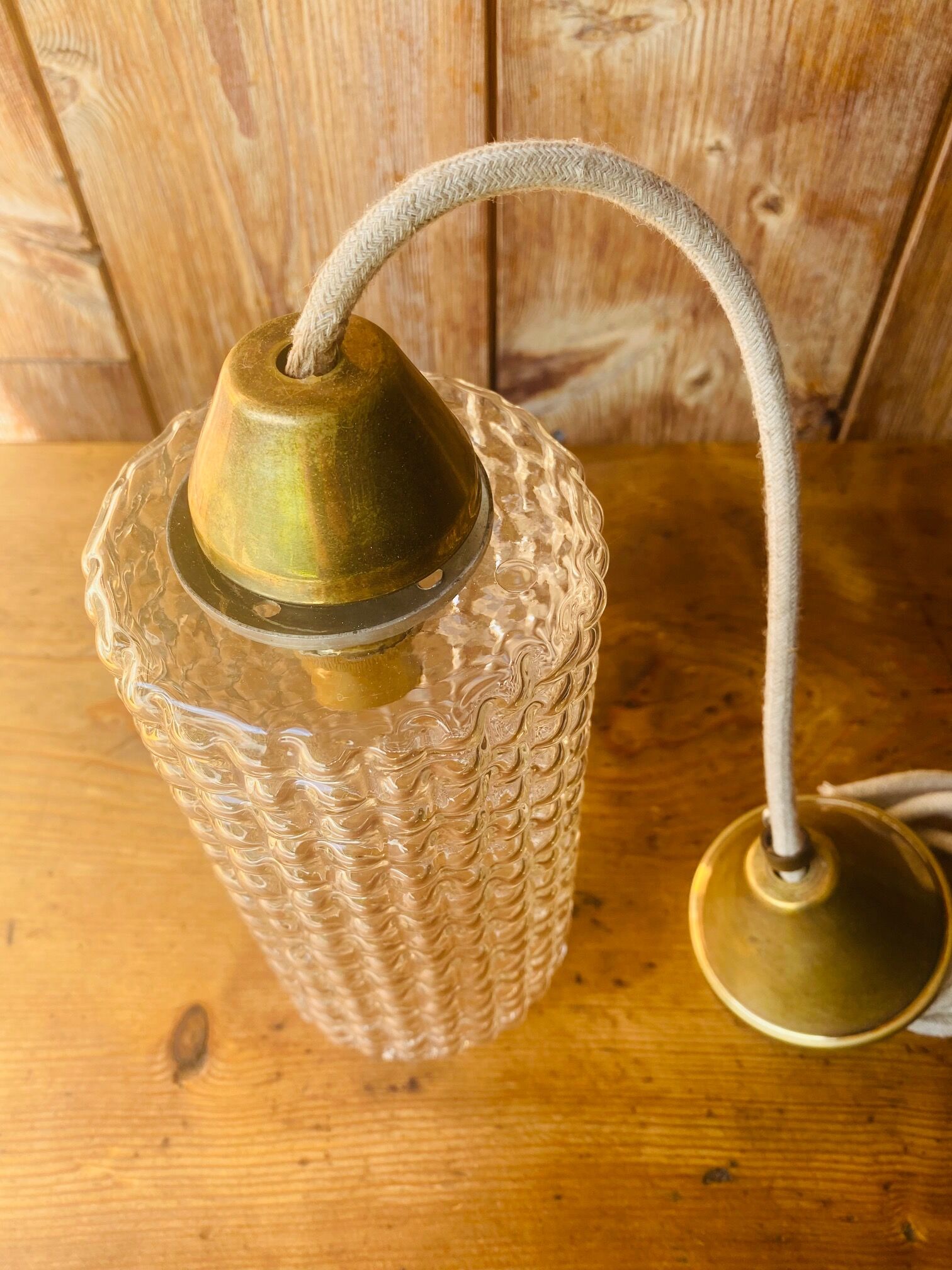 Glass and brass suspension.