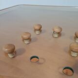 Rare coffee table 110 x 110 x height 35 cm with 8 flange wooden / cork caps in the glass top.