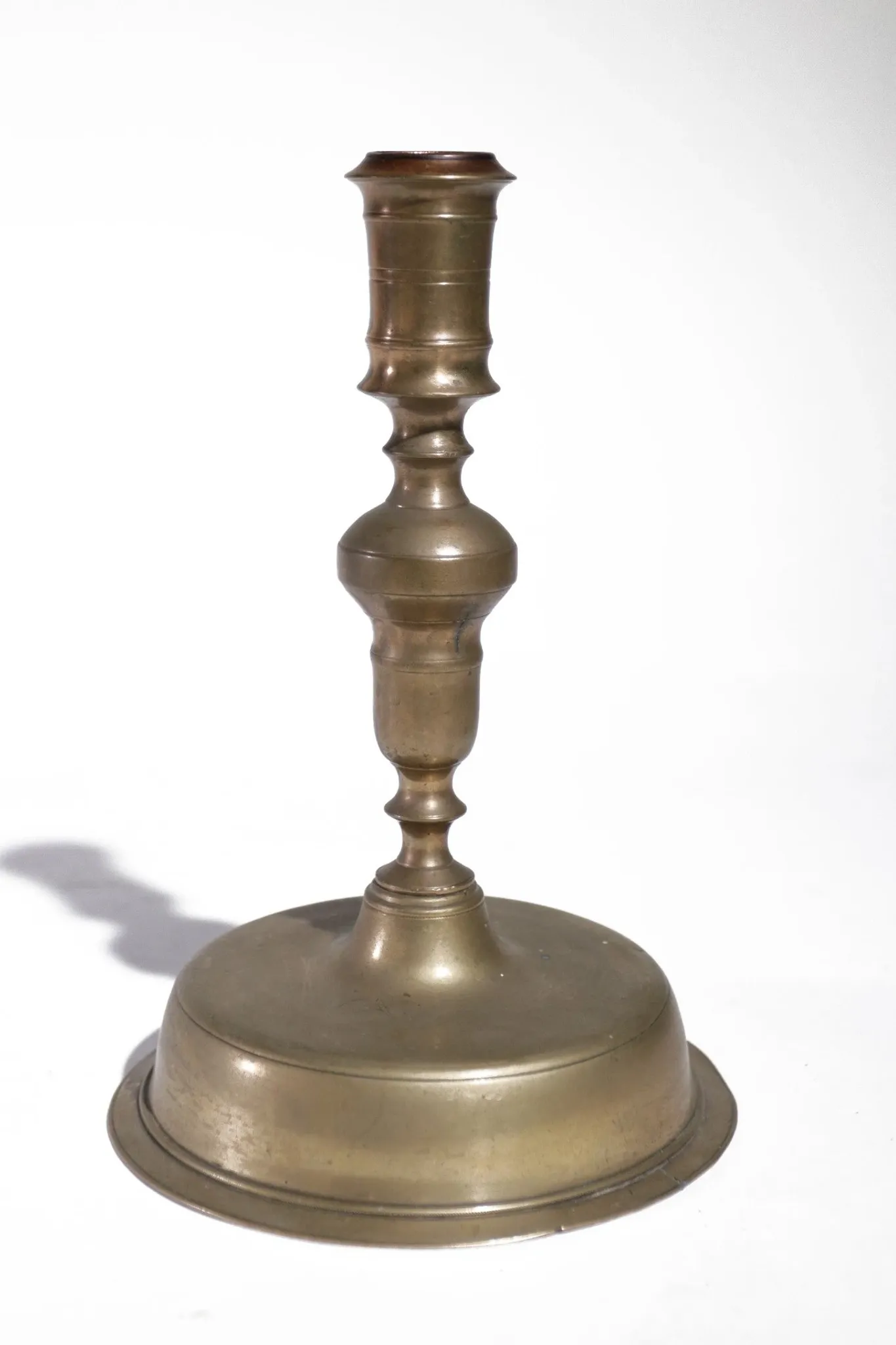 Large Spanish brass candlestick with low bell base – circa 1680-1730