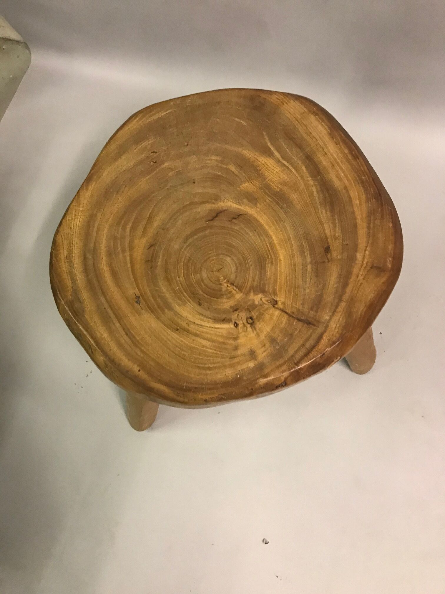 Two raw tripod stools