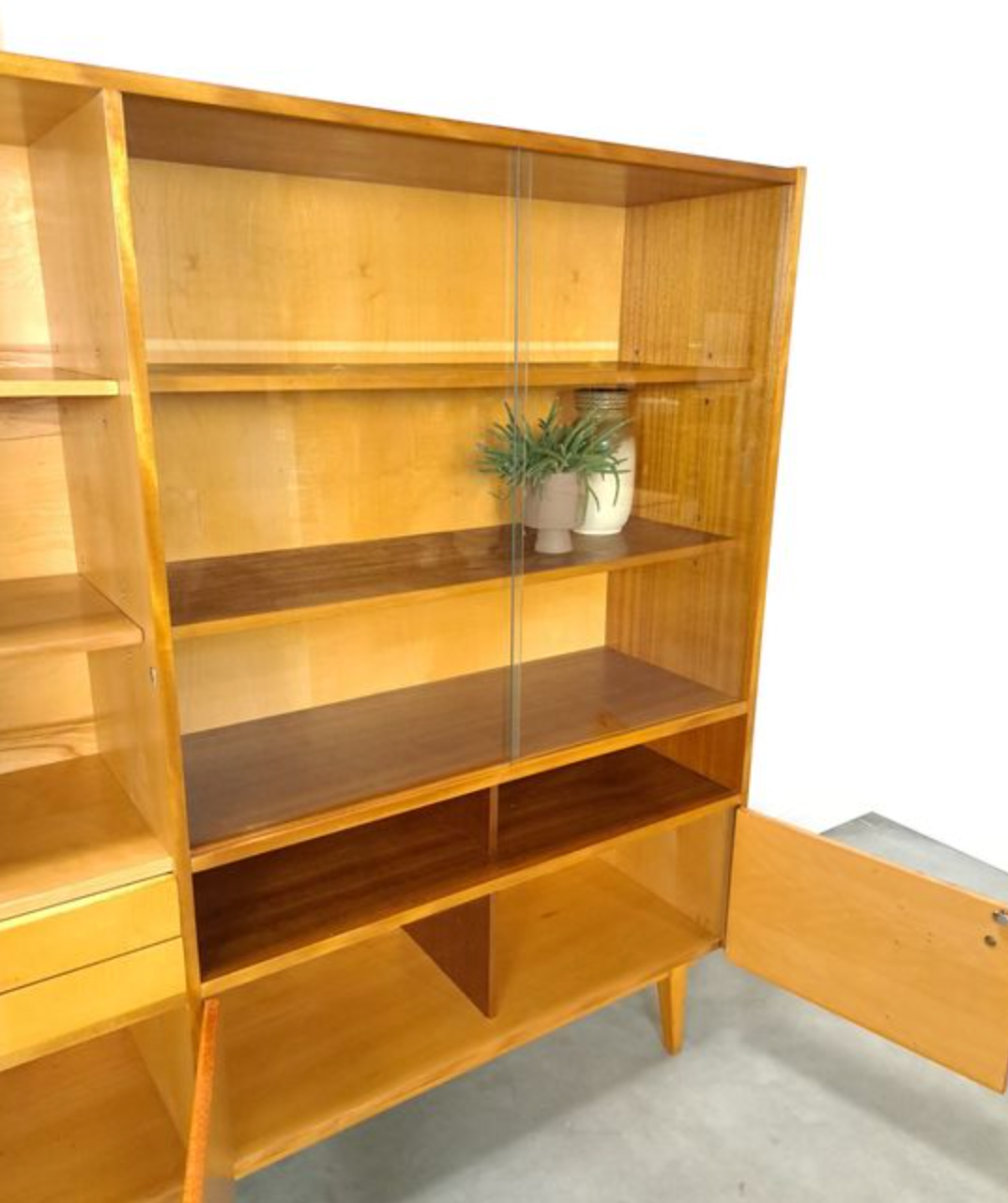 Vintage wooden sideboard with sliding glass doors and drawers