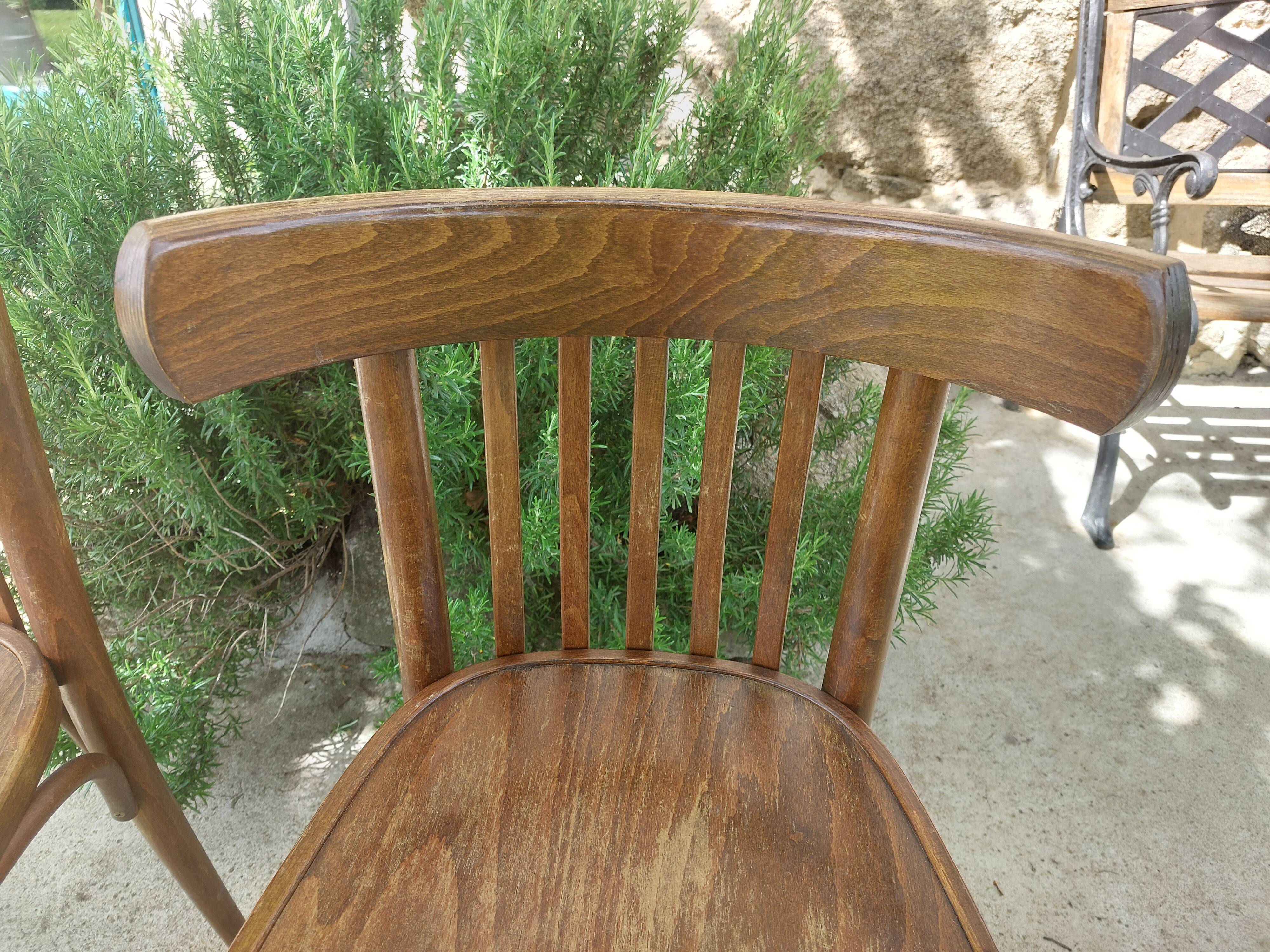 pair of dark bistro chairs, rounded backs, Baumann style