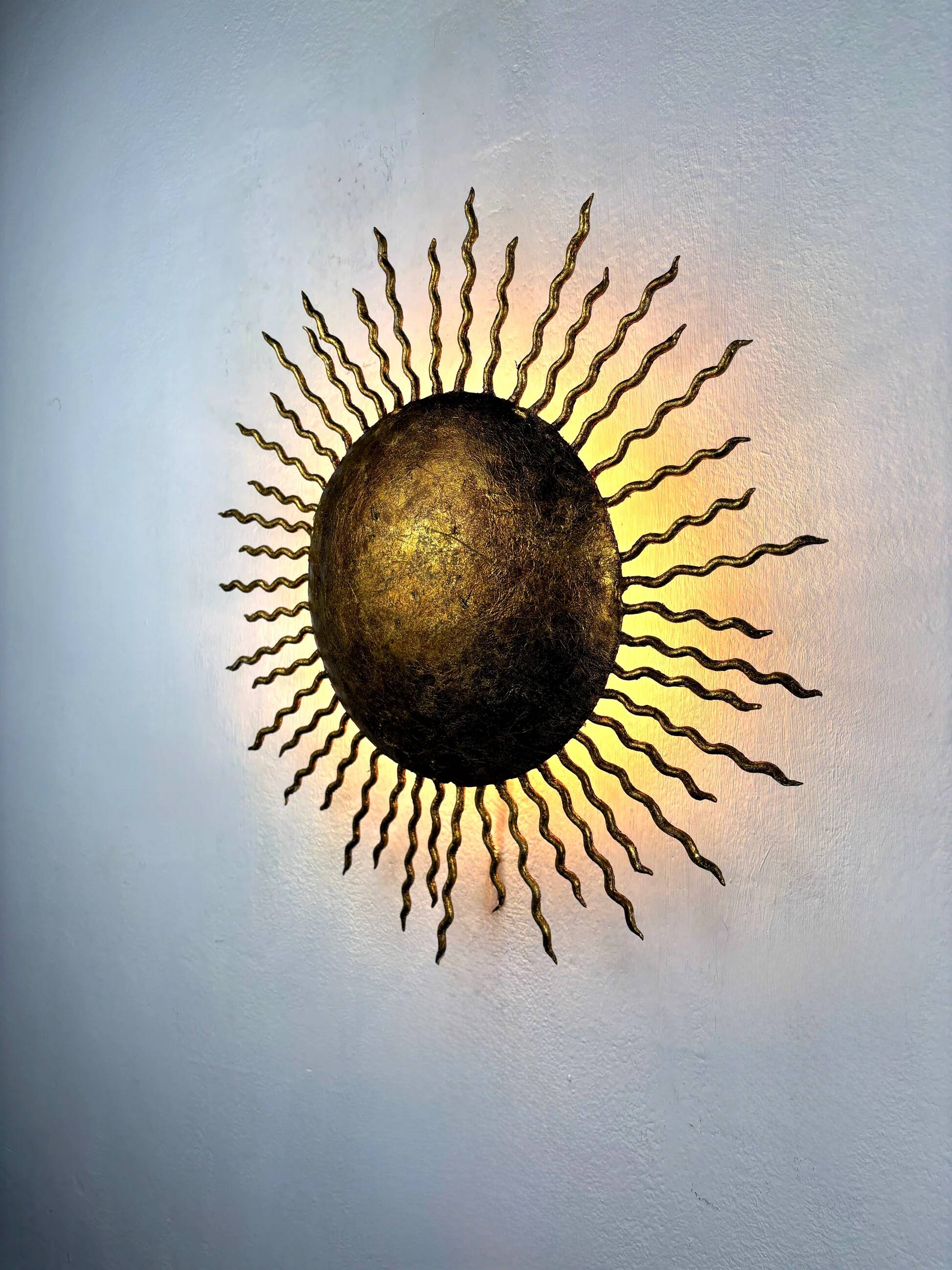 French gilt metal sunburst light fixture, Gilbert Poillerat, 1930s France