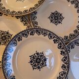 Set of 12 flat plates Terre de fer, Brienne model, HB&Cie manufacture, early twentieth century.
