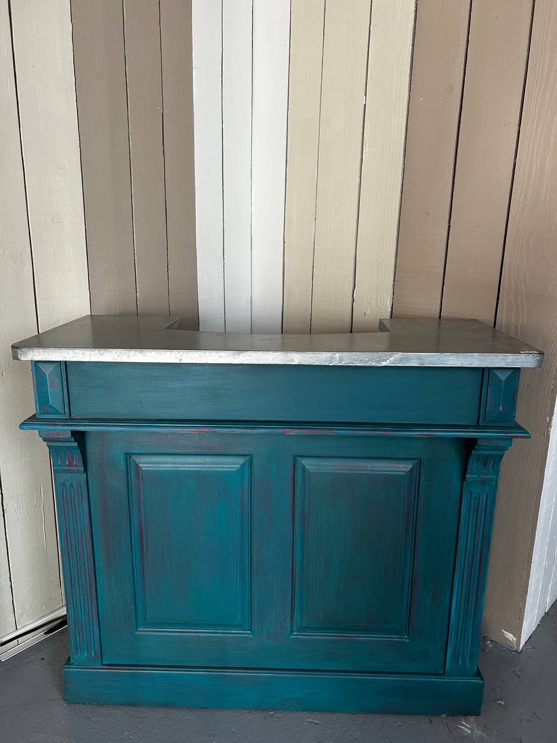 Old wooden trade counter with a zinc top.